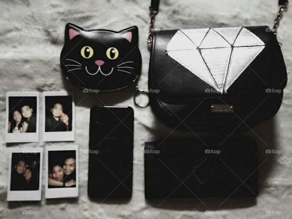 All things black and beautiful. 🖤
These are my essentials wherever I go. My phone, my Instax mini 9, wallet, coin purse, sling bag. And the rest will be taken by my boyfriend. 🤣