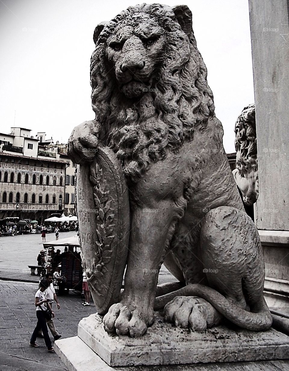 Lion and shield sculpture in Arrezo, Italy, near town square 