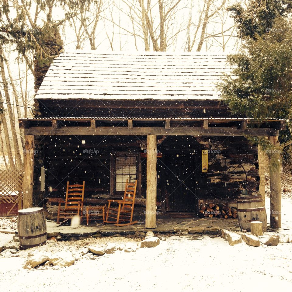 Cabin in the woods in the snow