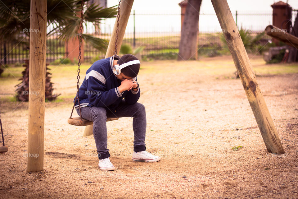 Young sad man sitting down worried for something 