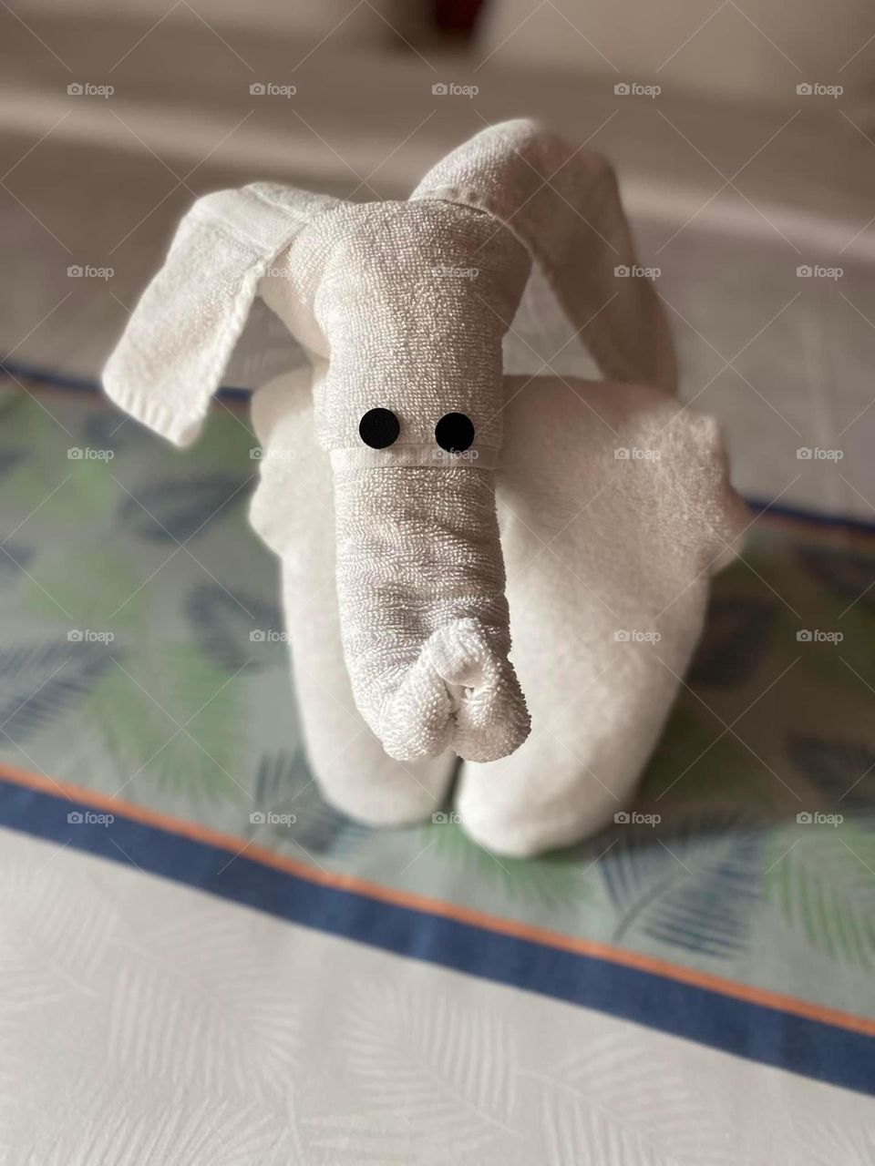 An elephant is made of towels on a cruise ship. Towel art is a fun way to be welcomed back to one’s room. 