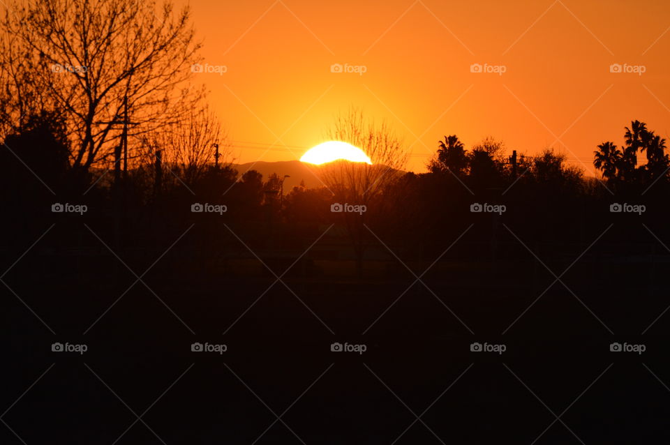 a yellow and orange sunset over the Sacramento River in Sacramento California