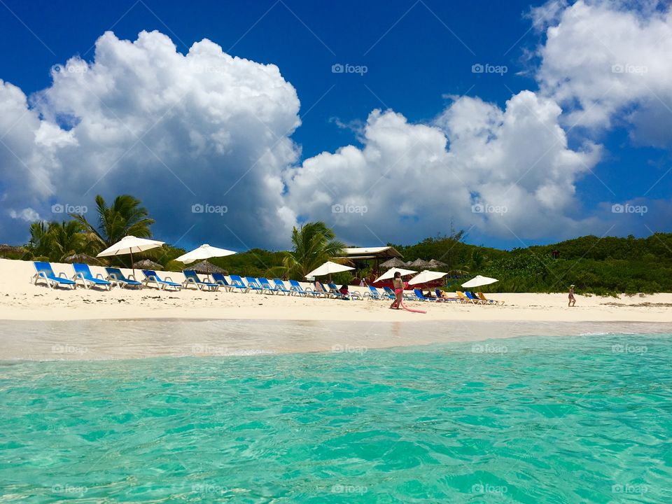 Lazy afternoon at the beautiful sandy beach with crystal clear waters of the Caribbean 