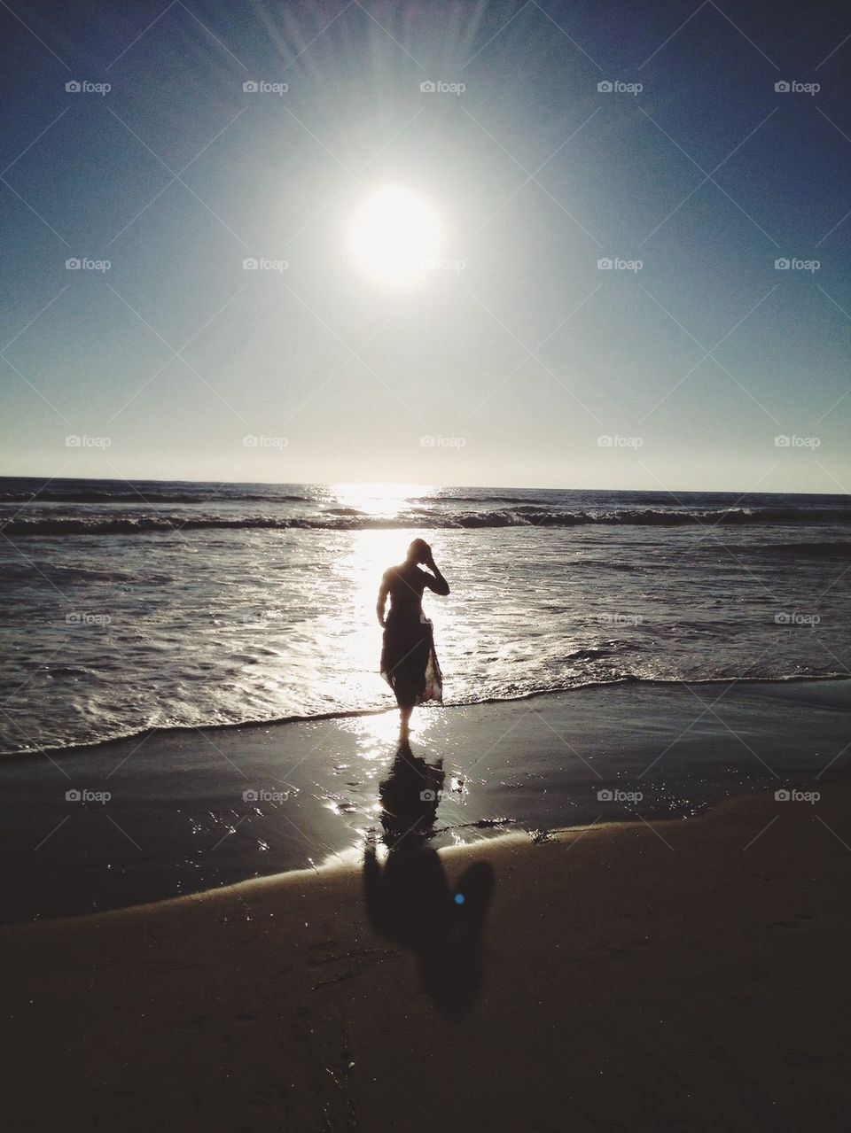 Girl at beach at sunset