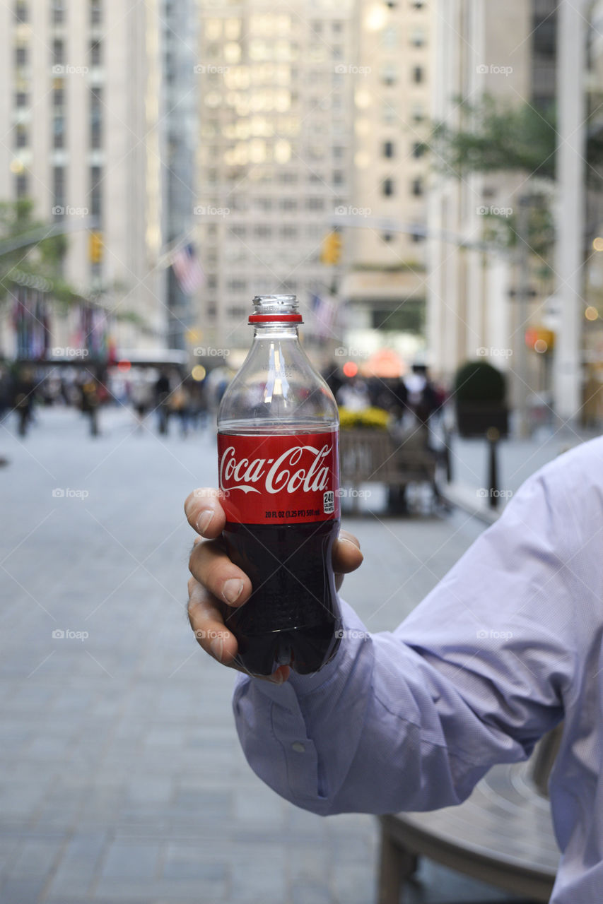 Man holding a Coke