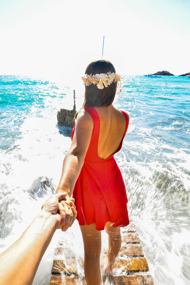 Two people holding hands