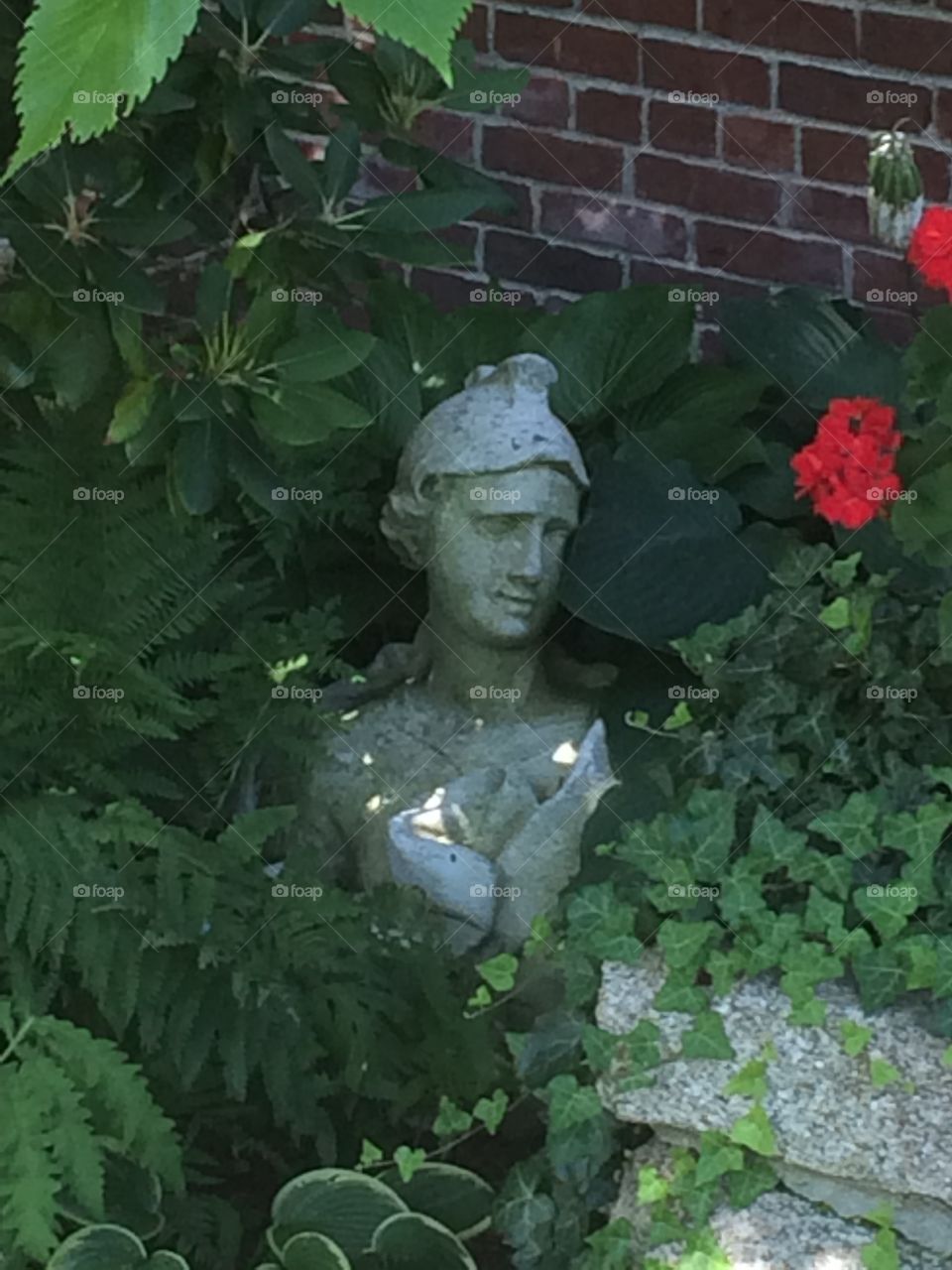 Hidden statue with a burst of red.