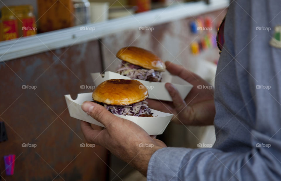 Close-up of person holding sandwich