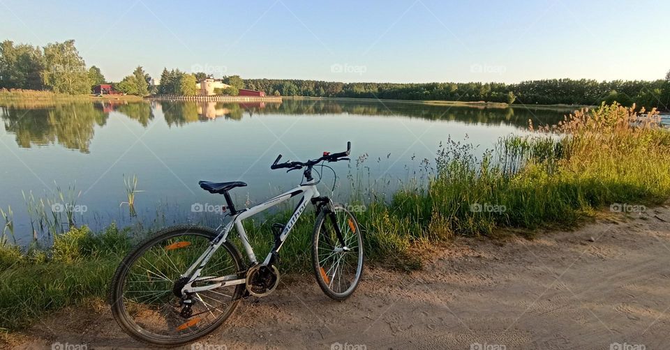 bike on a lake shore summer time