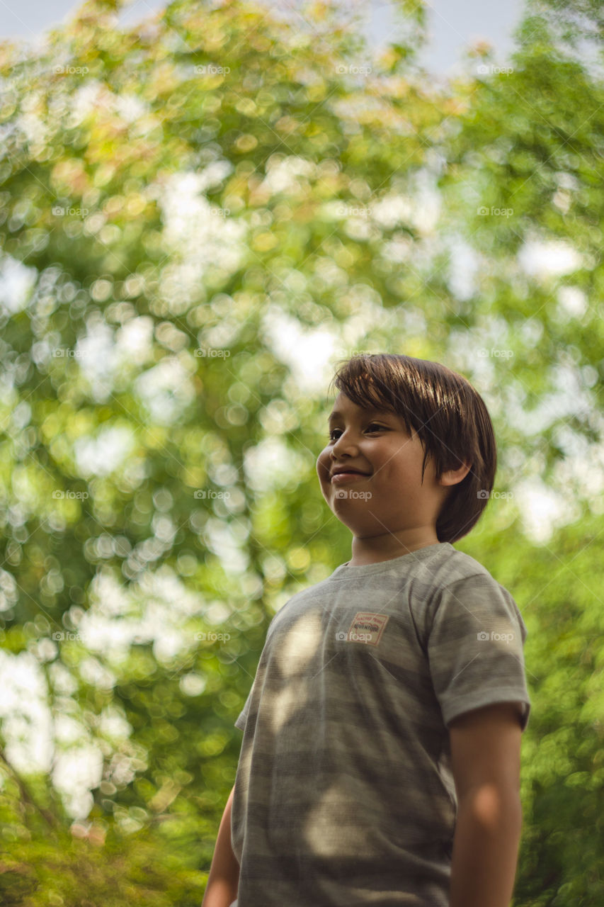 bokehlicious outdoor portrait of a young Eurasian boy