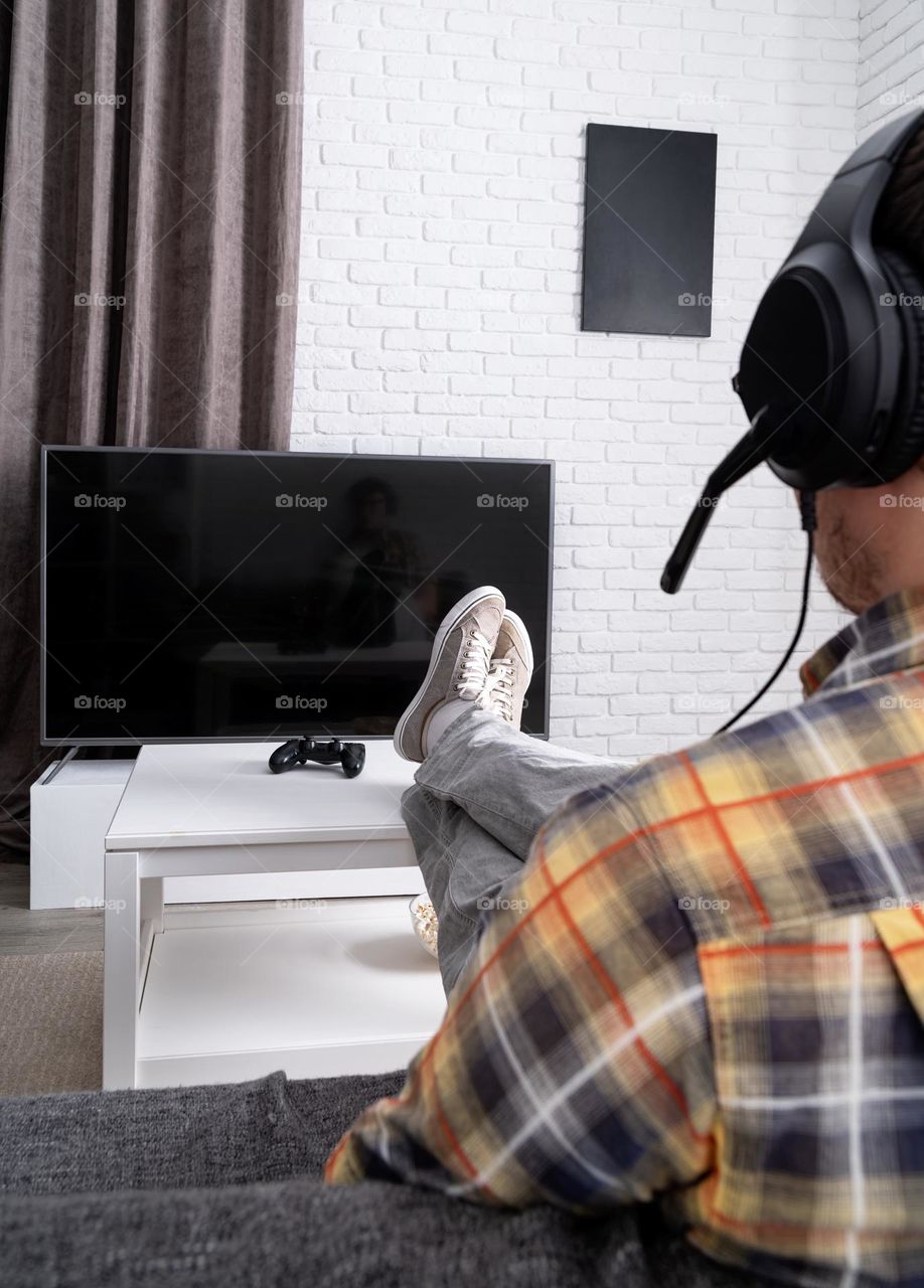 young emotional man playing video games