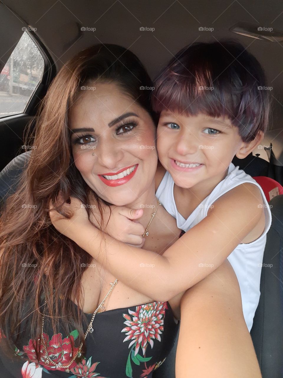 smiling woman and child in the car