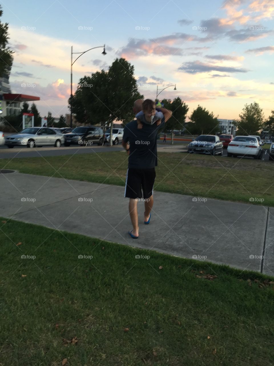 Walking at night father and son 