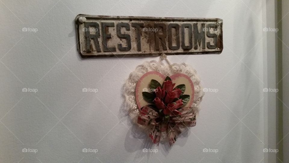 restroom sign with heart