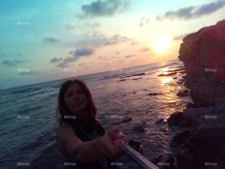 woman on a sea sunset