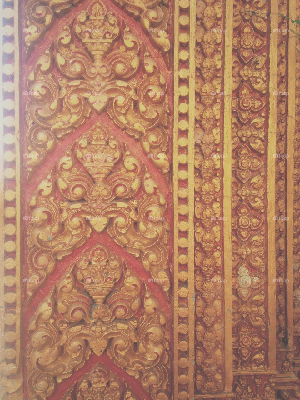 Traditional Khmer ornaments at the entrance gate of the pagoda 