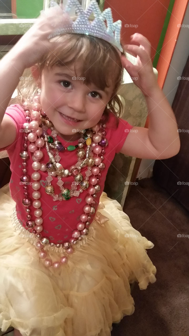 Close-up of acute girl wearing crown