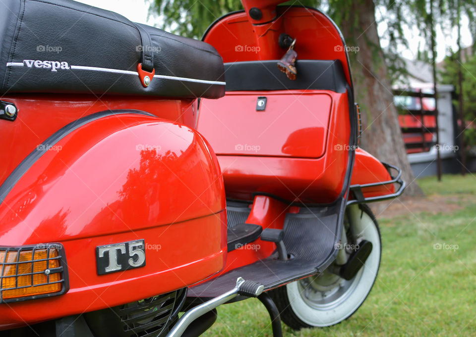 red italian piaggio vespa T5 motorcycle