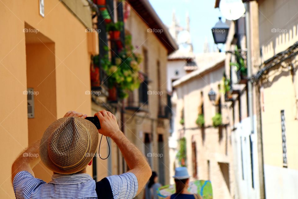 Tourist in action. Tourist in action on the beautiful streets of Toledo