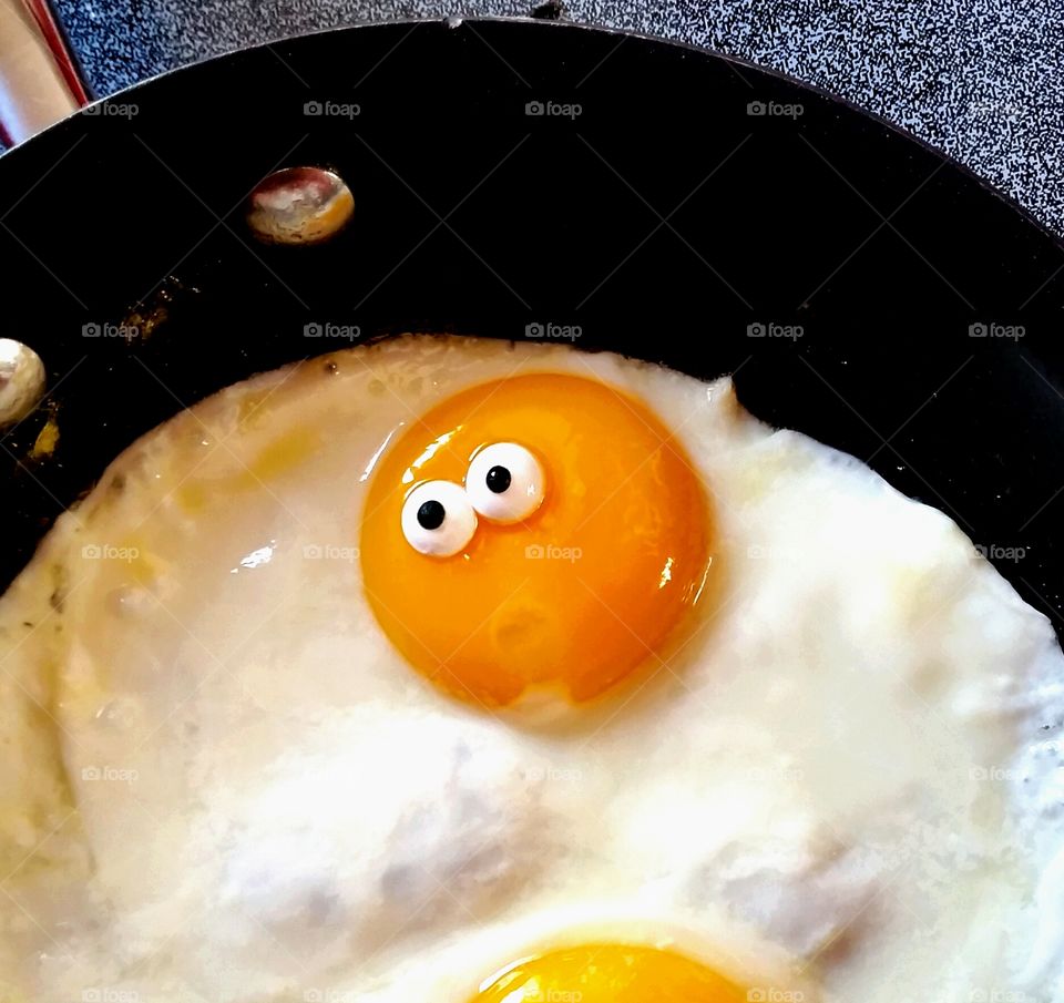 Elevated view of making egg in pan