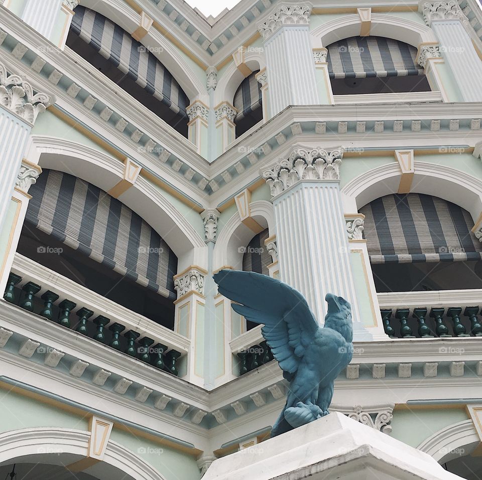A bronze eagle sculpture outside the Peranakan Museum in Singapore.