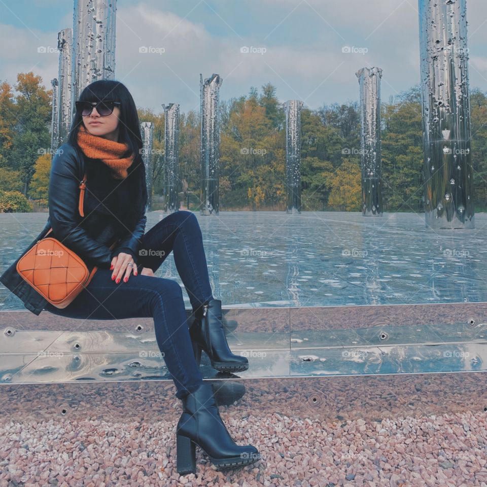 Girl sitting on metal steps