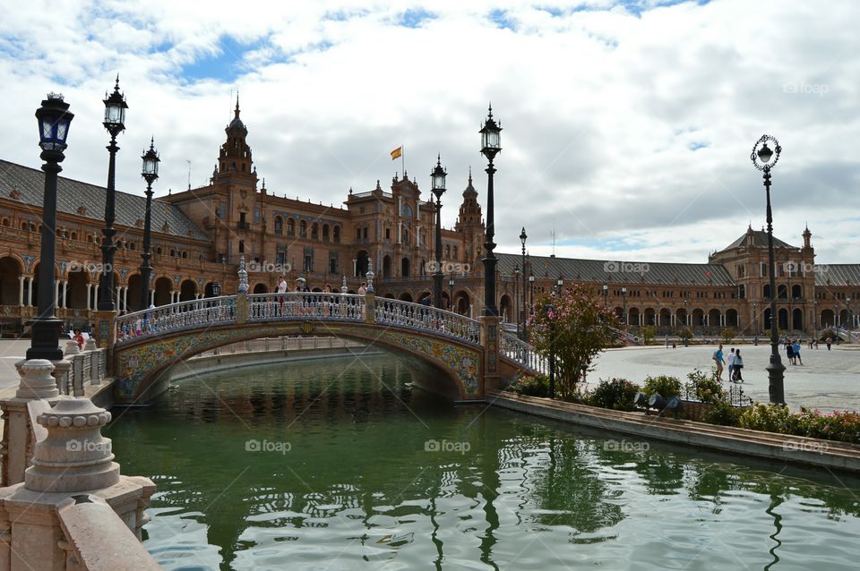 Bridge - Plaza de España. View of one of the bridges and the government building at Plaza de España, Seville, Spain.