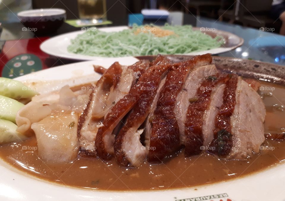 The roasted duck by sliced to a small piece poured with bean sauce