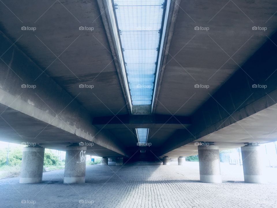 Underneath the Connaught Bridge to the west of London City Airport, looking south. In Spring.