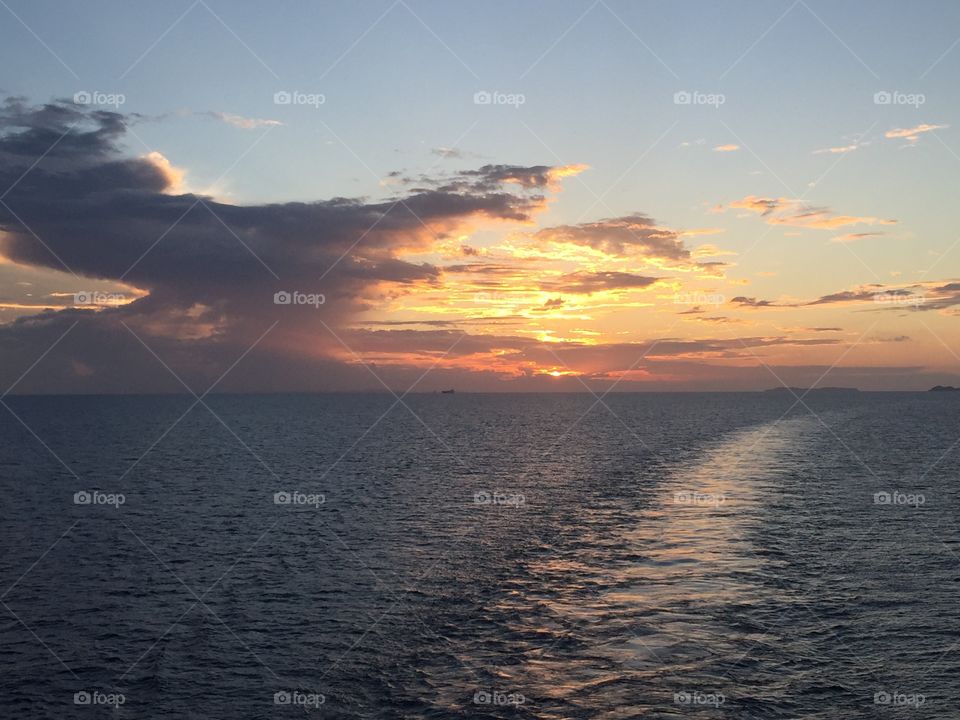 Sunset behind the ship