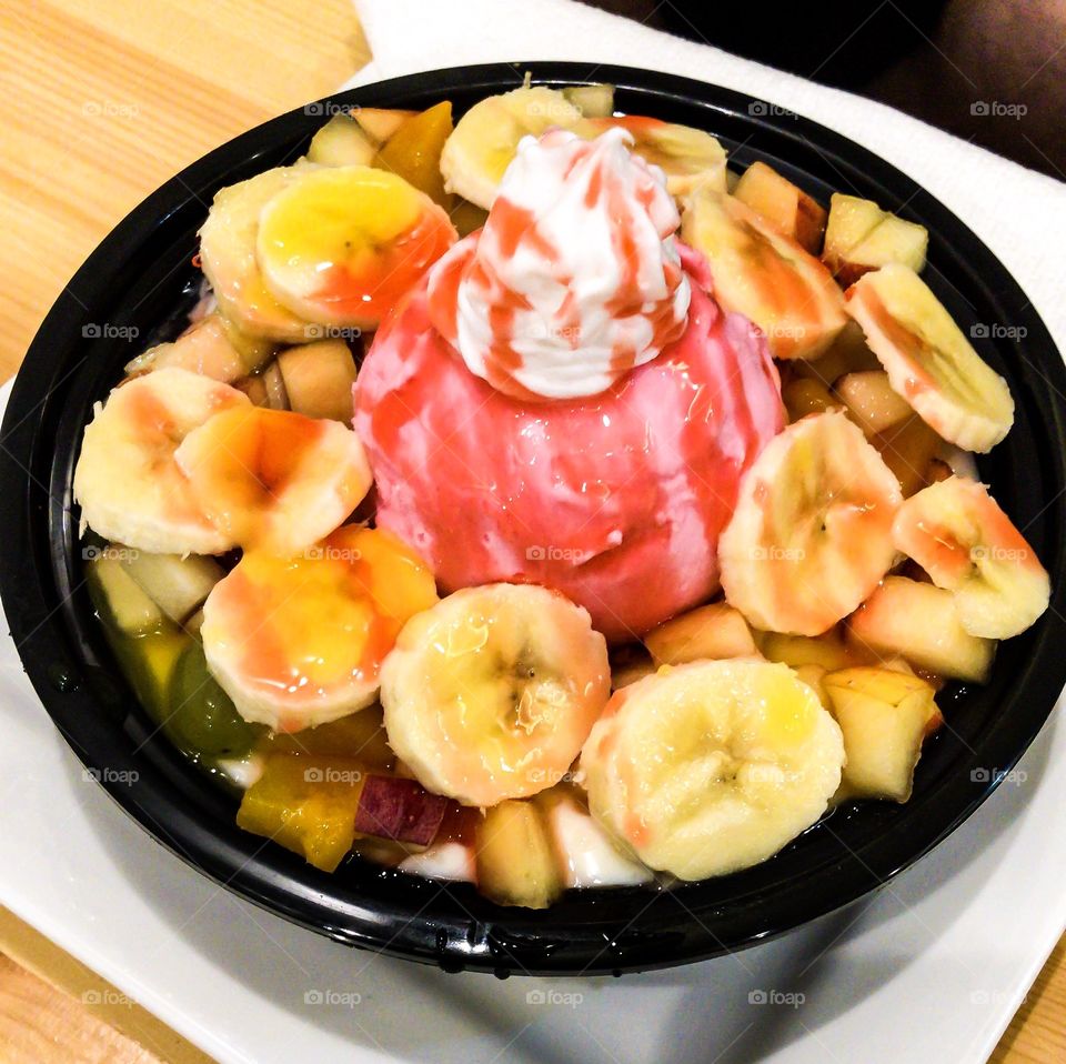 Traditional Arabic sweet ( Rise with milk and ice cream plus fruit salad)