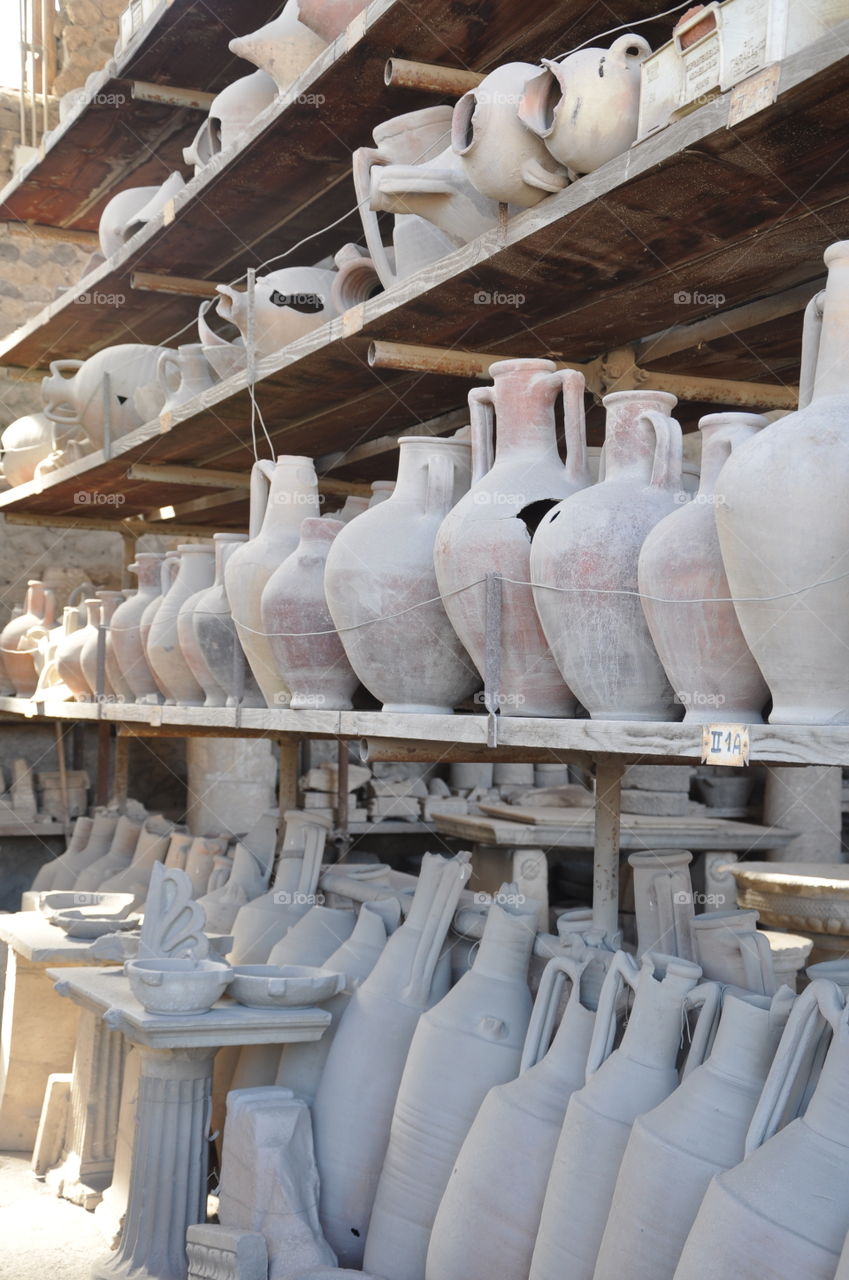 Pompeii ruins rows of pottery artifacts found during excavation after the blast of mountain Vesuvius 