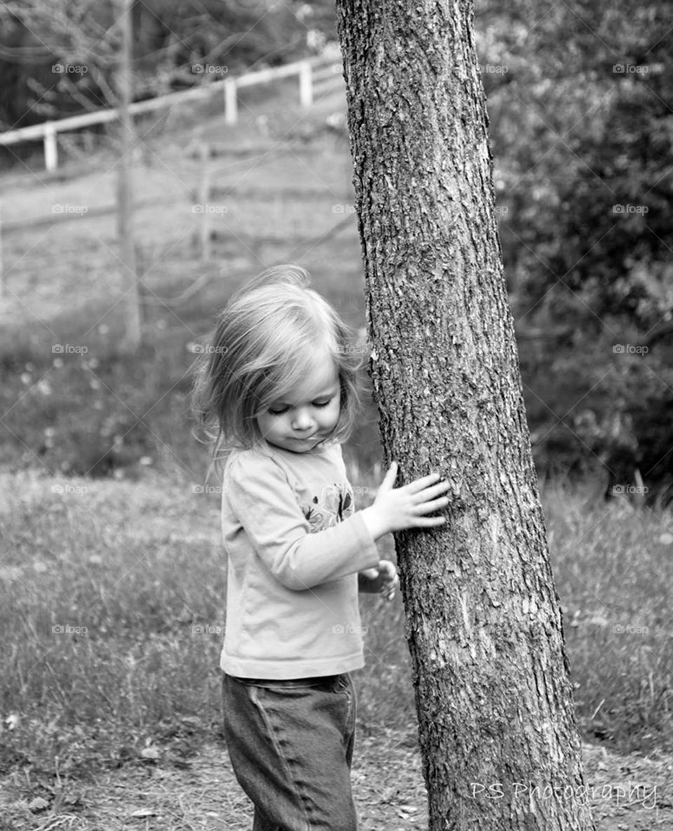 little girl. playing hide and seek