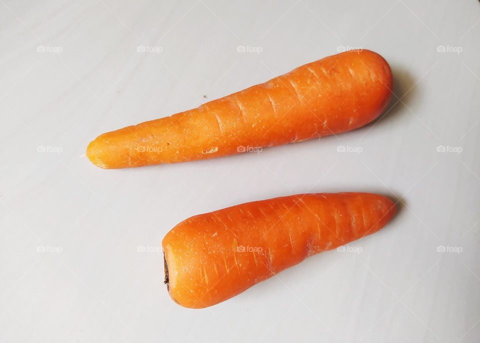 Two carrots isolated on white background