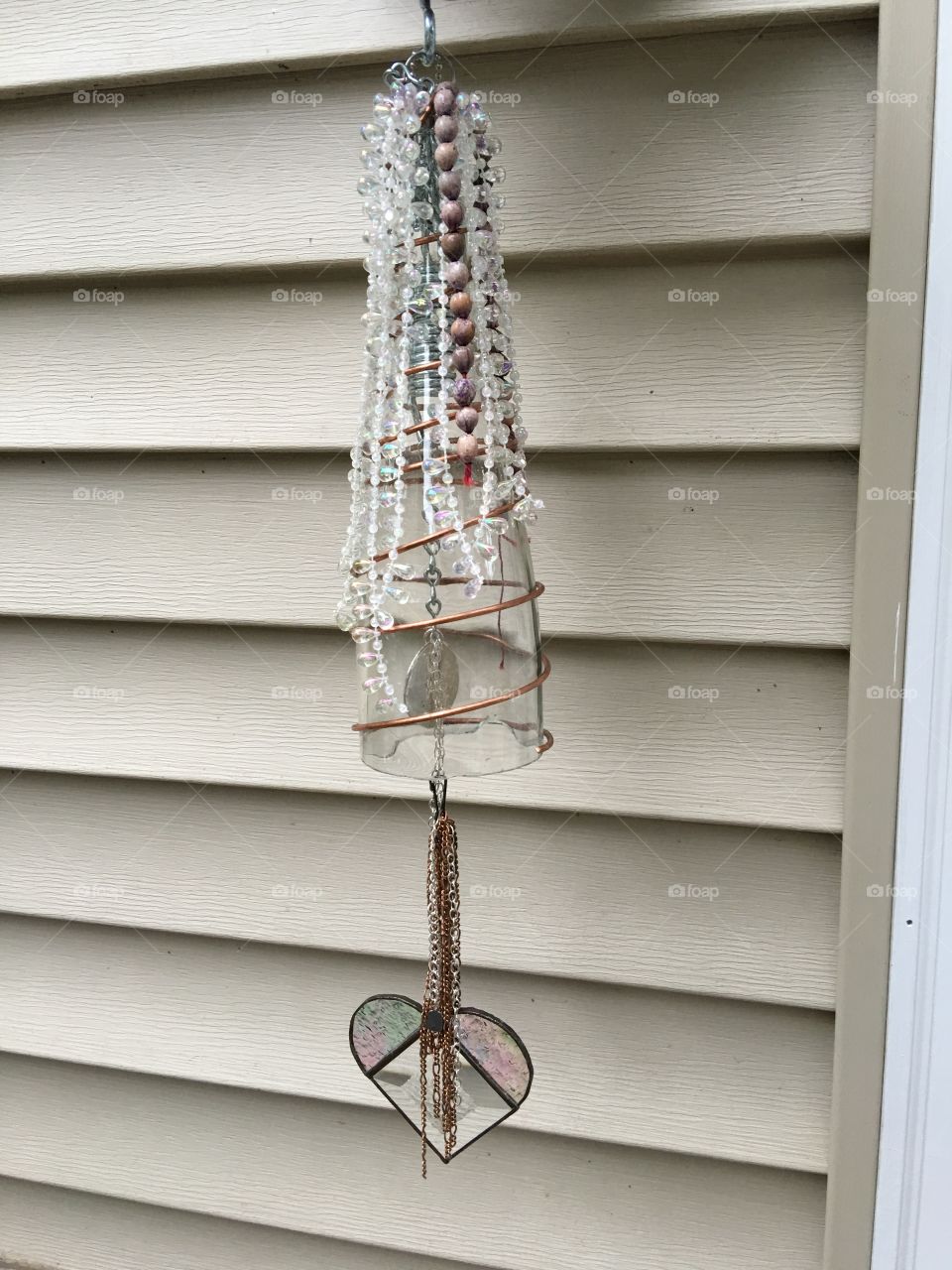 Using recycled items to create a new wind chime 