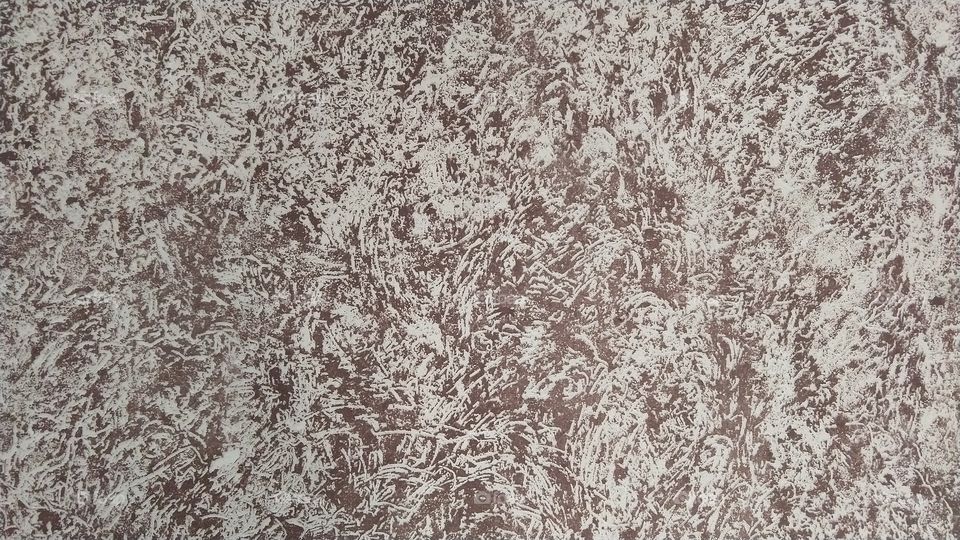 Textura de grafiato em parede. trabalhos em pintura residencial. Fundo, declaração.