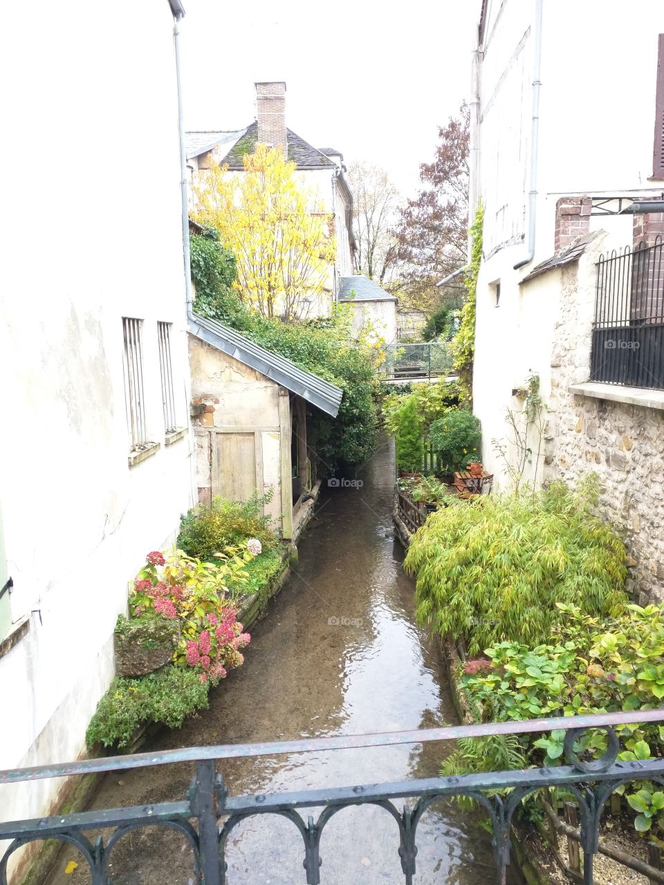 A brook through houses, France
