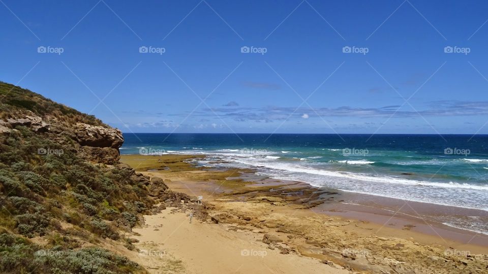 beautiful view from the cliffs and dunes of the coast line, on a gorgeous summer day with a bright blue sky