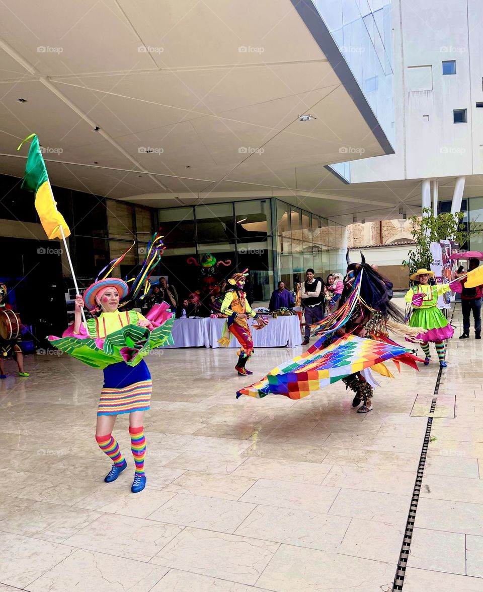A crowd  cultural square people dancing 