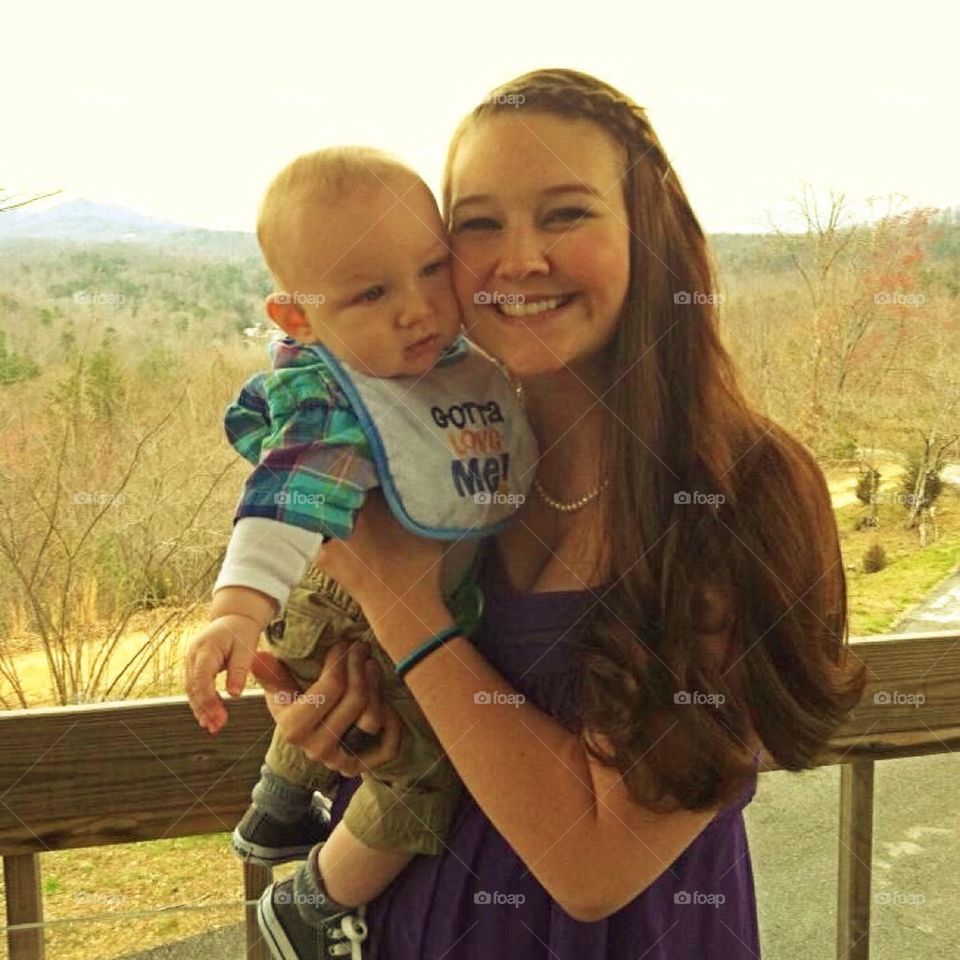 Baby boy and mommy at friends wedding