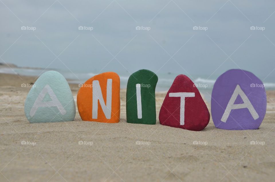 Anita, female name on colourful stones