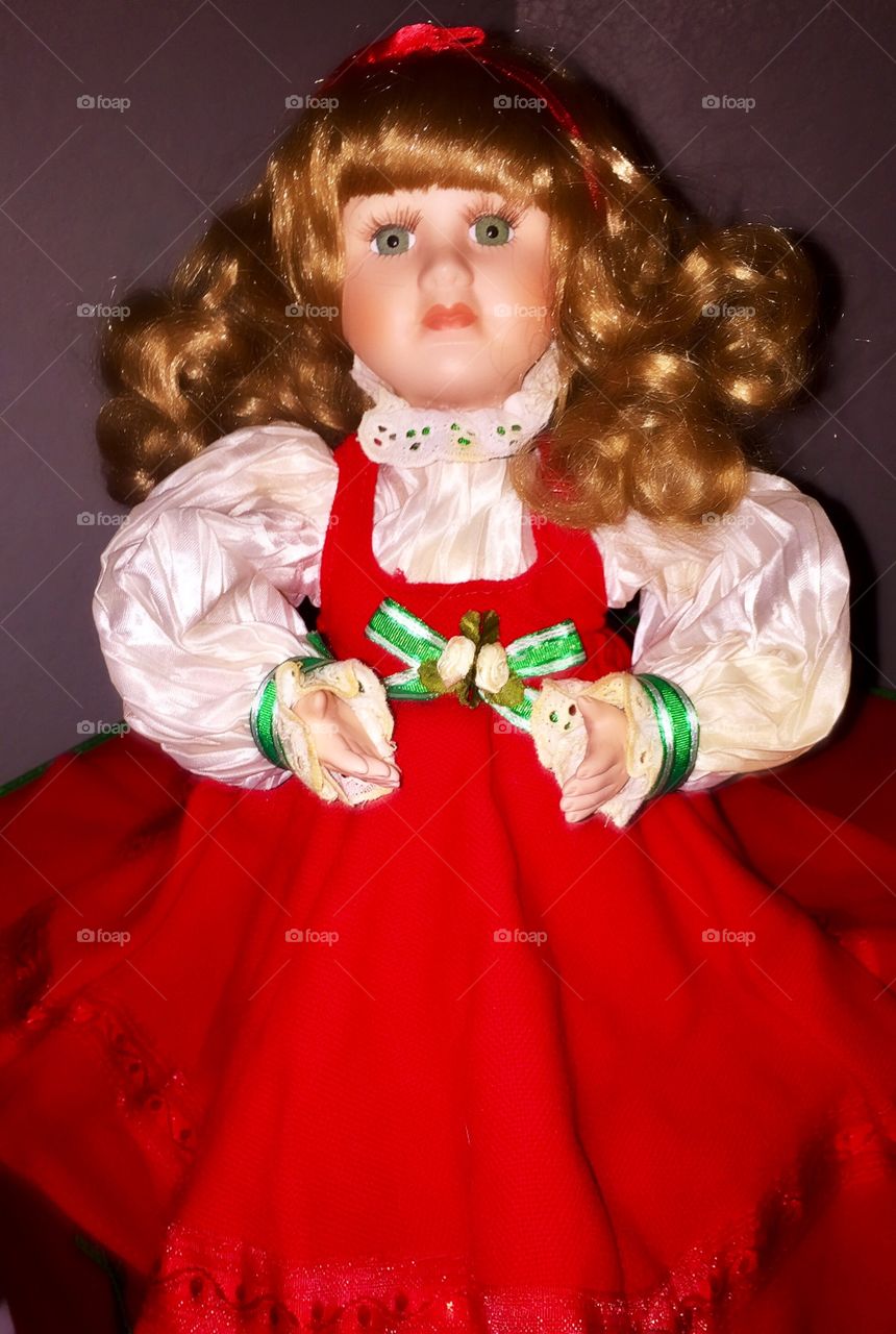 Doll in red dress.