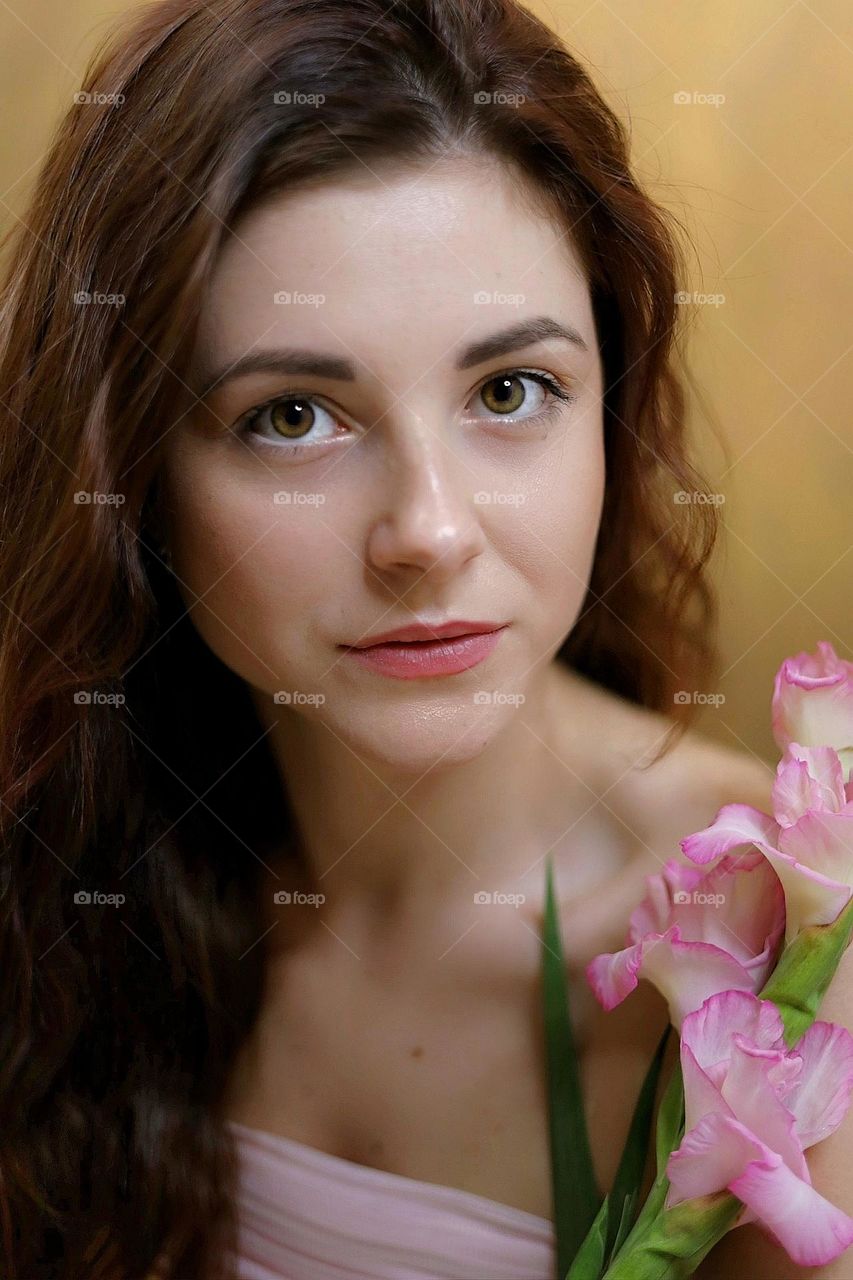 Beautiful young lady portrait . Natural beauty. Woman with flowers.