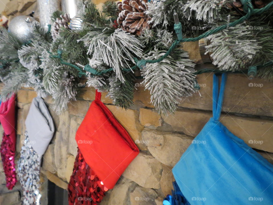 Christmas stockings hanging on the fireplace.