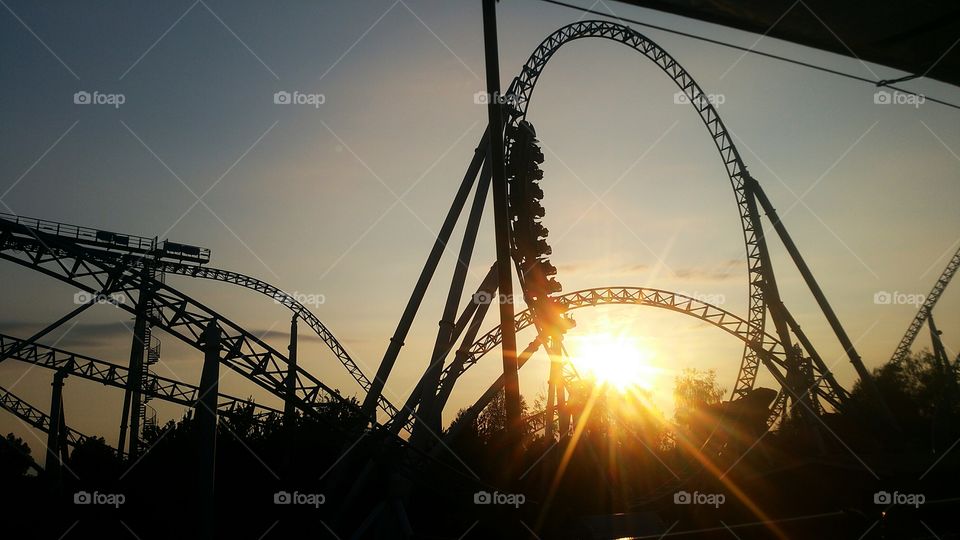 rolercoaster sunset light reflection fun