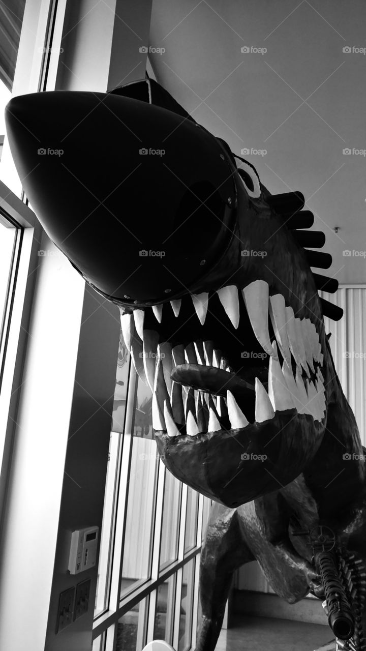 Machine gun wielding dinosaur