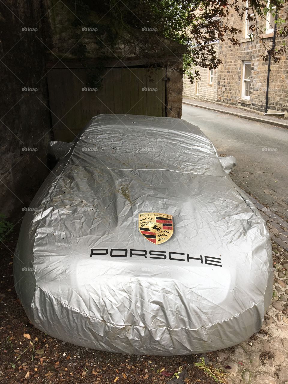 Protecting the Porsche ... do they not own a garage ?