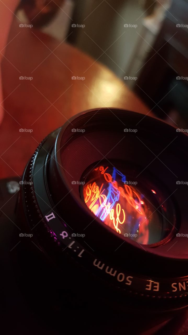 Lucky 17 neon sign reflected into camera lense
