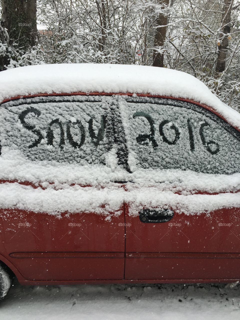 Snow captioned car.