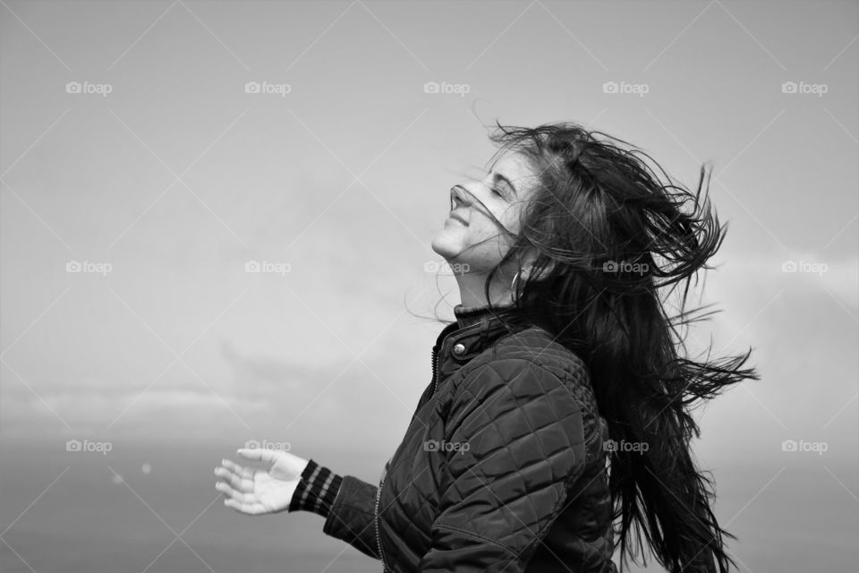 A woman enjoying the wind, San Francisco, Battery Park
